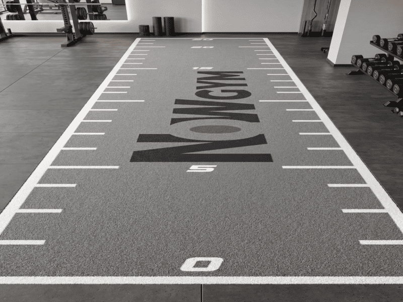 inspecting turf ripples in a gym